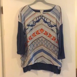 Blue 3/4 length sleeved tshirt with a polyester multi colored front